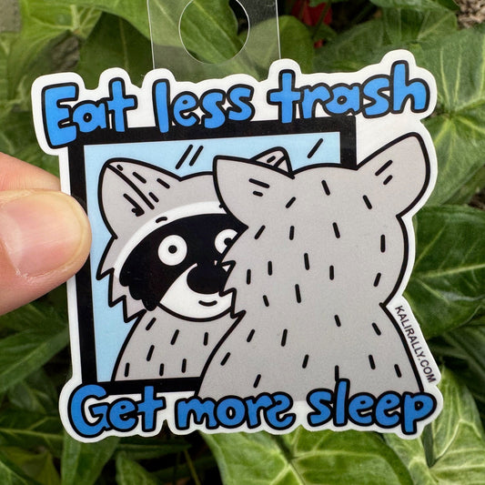 Funny water bottle sticker with cartoon raccoon – “Eat less trash, get more sleep.” decal for water bottles and laptops by Kalirally