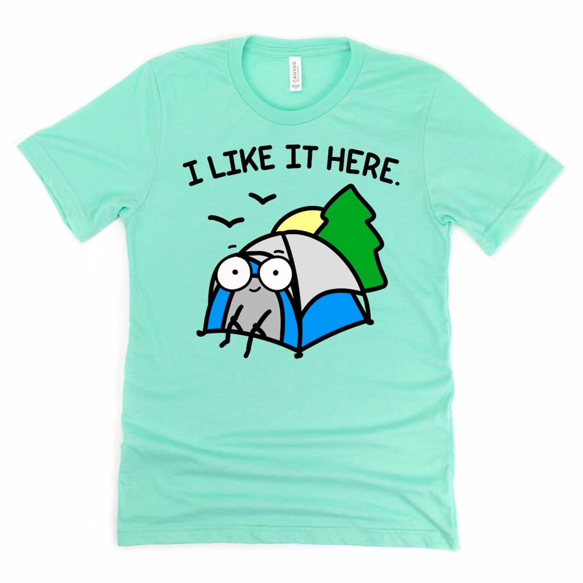 Solitude Camping Shirt in Heather Mint Green with tent illustration and outdoors phrase “I like it here,” by Kalirally