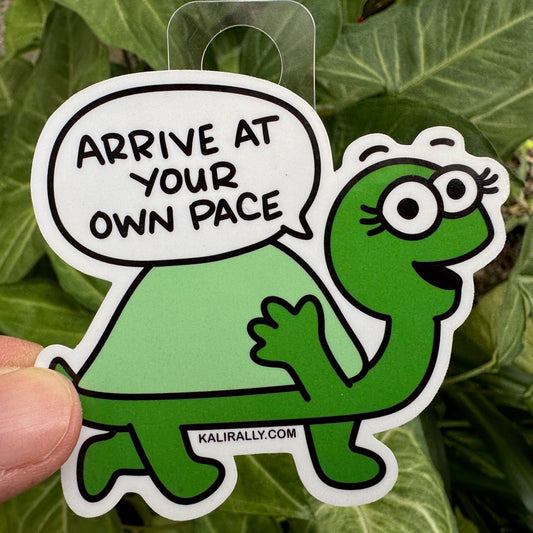 Turtle Sticker with cartoon tortoise and phrase “Arrive at your own pace,” motivational decal by Kalirally.