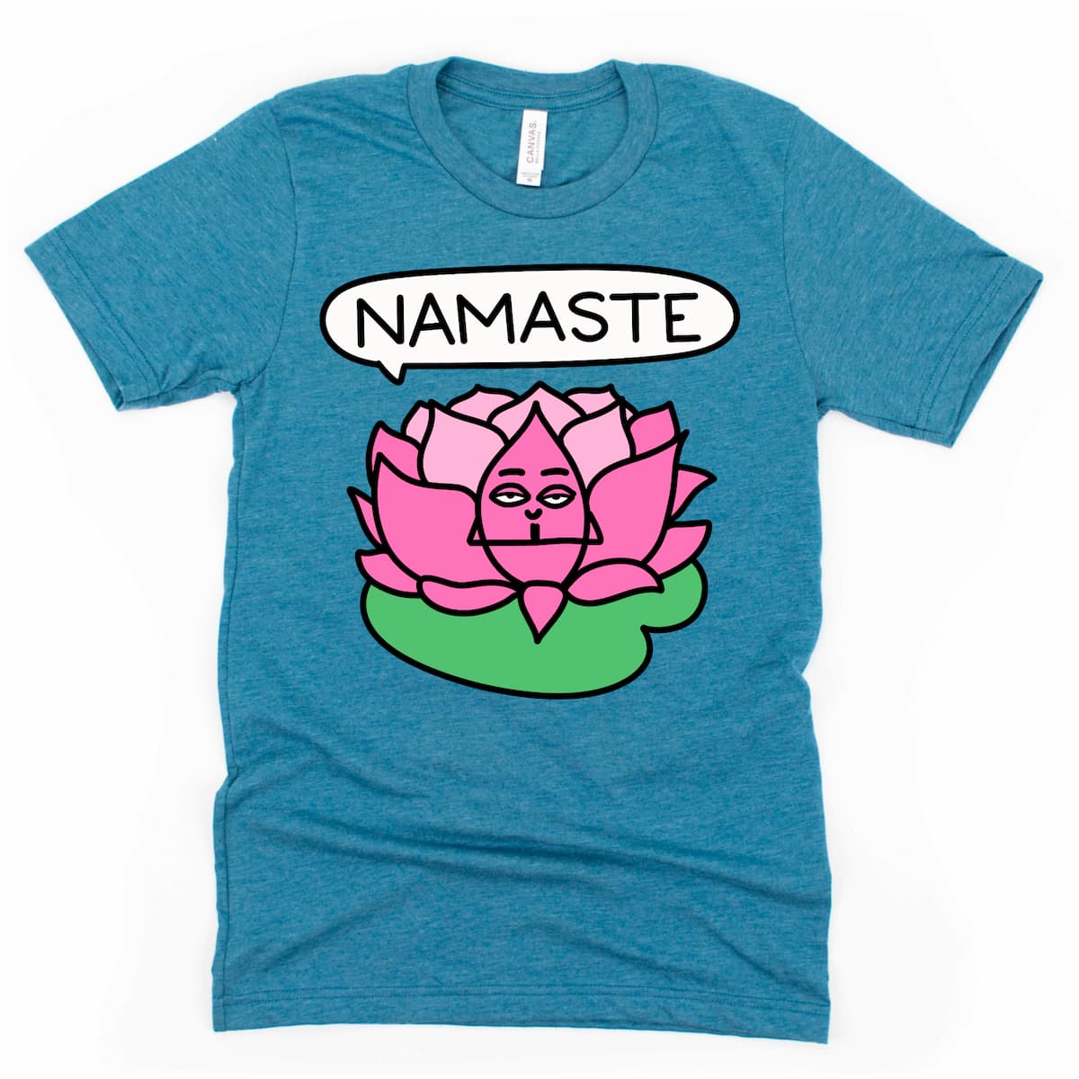 Flat lay of deep teal yoga tee with cartoon lotus and namaste design – relaxed yoga top