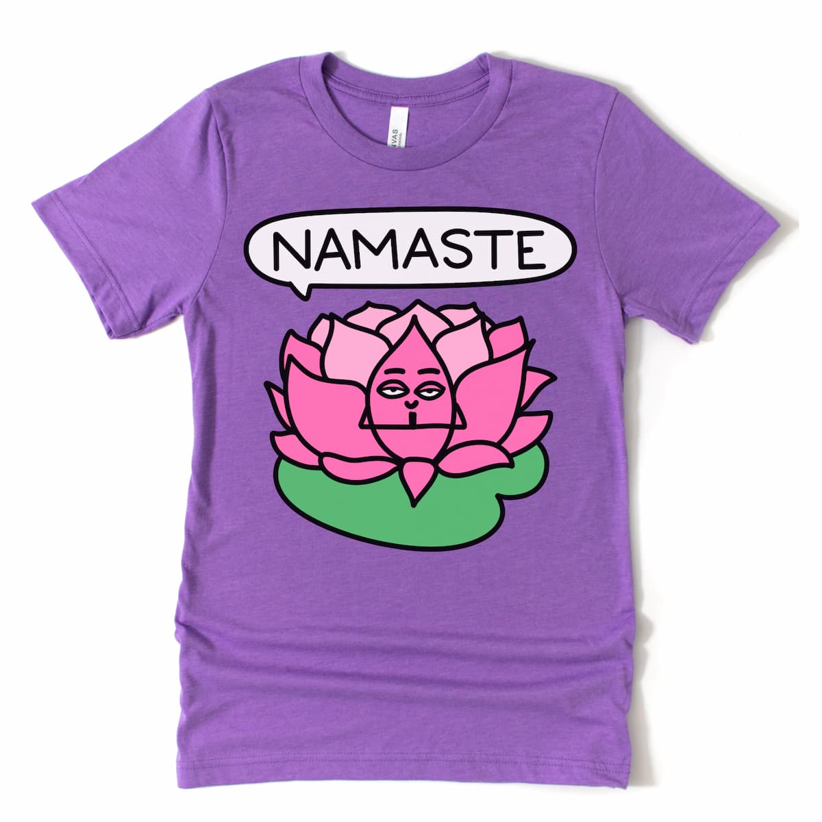Flat lay of purple yoga t-shirt with seated lotus cartoon and “Namaste” text – calming women's yoga shirt