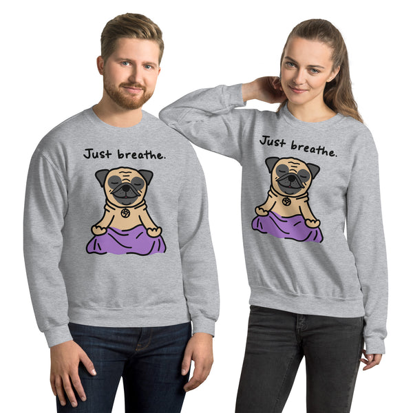 "Just Breathe Pug Sweatshirt featuring a cute cartoon pug in a sitting yoga pose. Cozy and perfect for pug lovers and yoga enthusiasts, available for wholesale and art licensing."